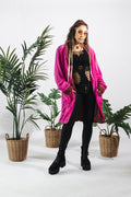 a woman in a pink coat