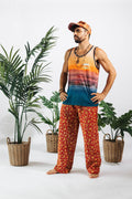 a man in colorful pants and a tank top