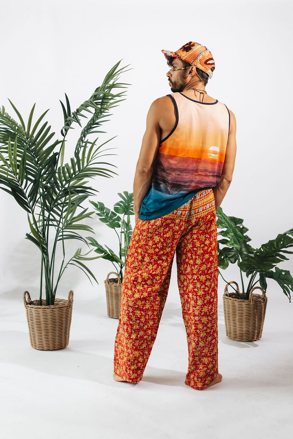 a man in a tank top and pants