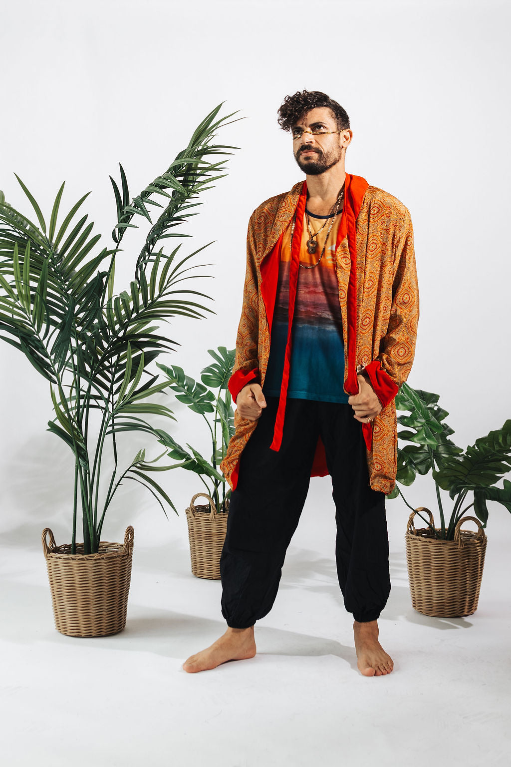 a man standing in front of plants