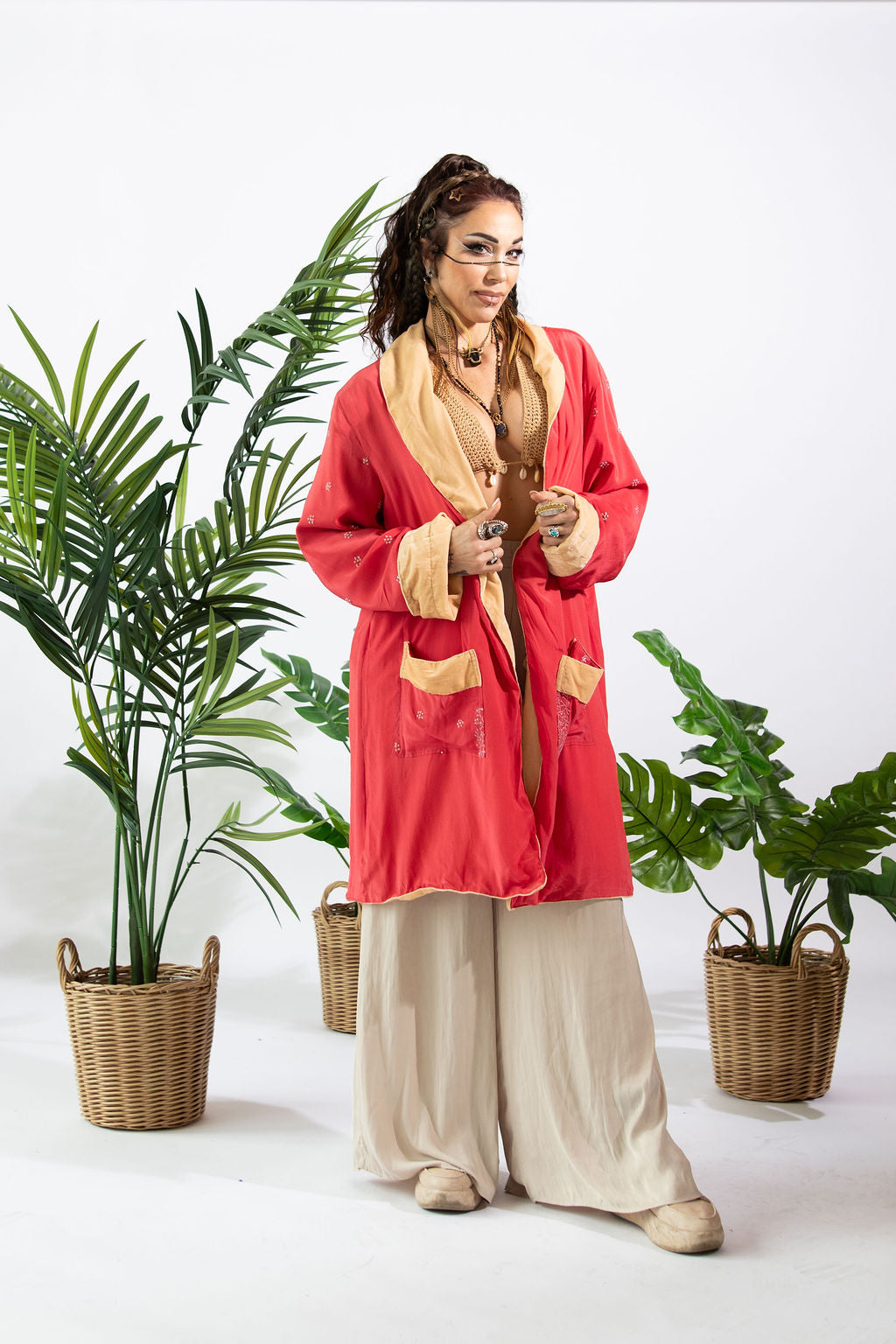 a woman standing in front of plants