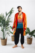 a man standing in front of plants