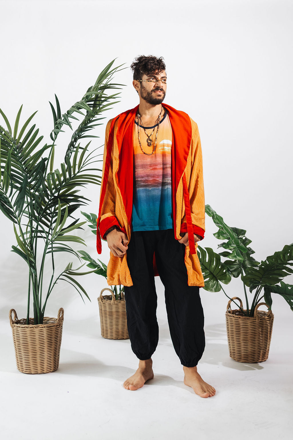 a man standing in front of plants